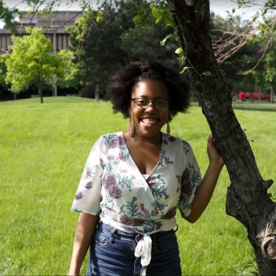 student smiling on campus