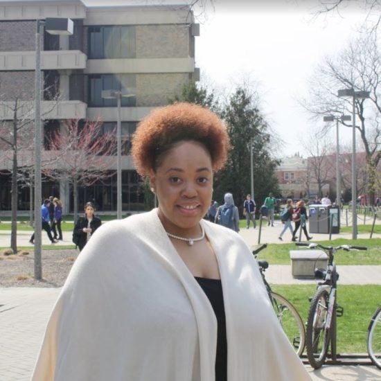 student smiling on campus