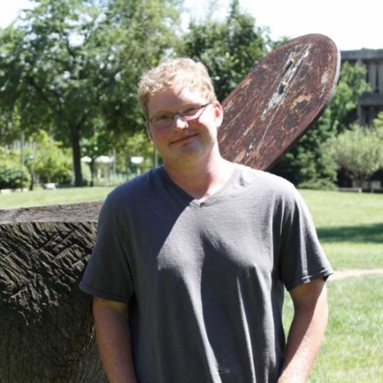 student smiling on campus