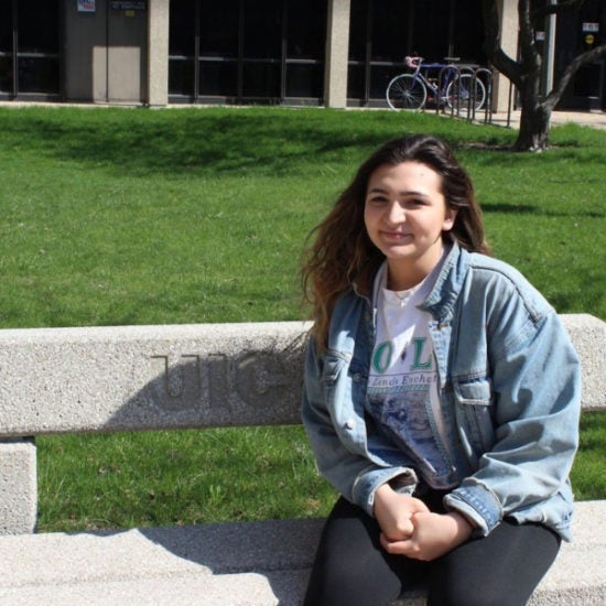 student smiling on campus