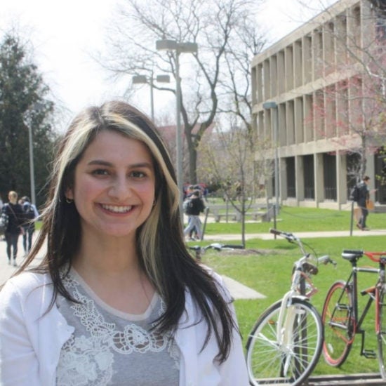 student smiling on campus