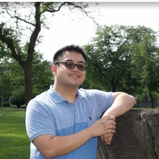 student smiling on campus