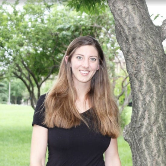 student smiling on campus