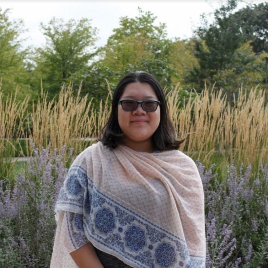 student smiling on campus