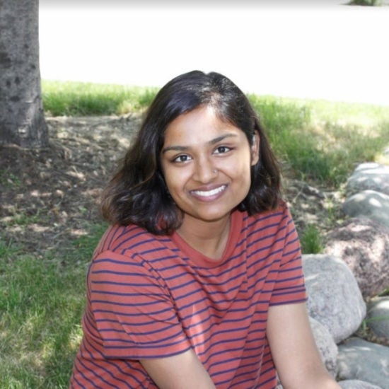 student smiling on campus