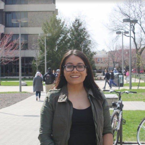 student smiling on campus