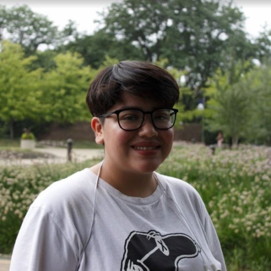 student smiling on campus