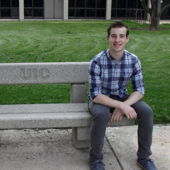 student smiling on campus