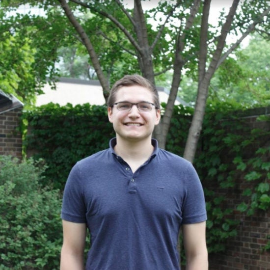 student smiling on campus