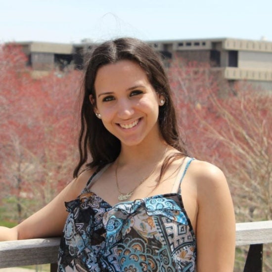 student smiling on campus