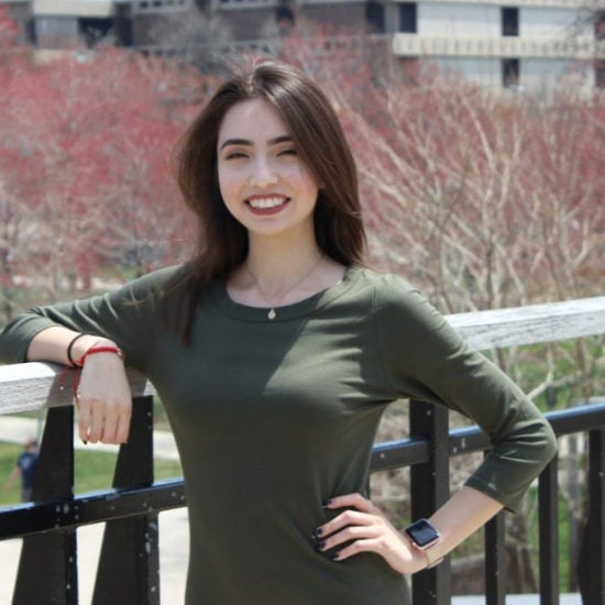 student smiling on campus