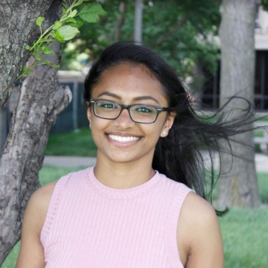 student smiling on campus