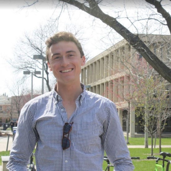 student smiling on campus