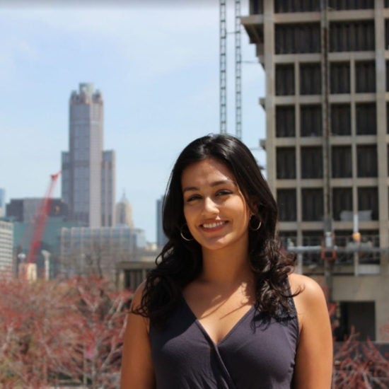 student smiling on campus