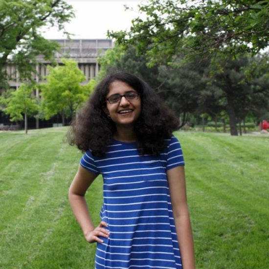 student smiling on campus