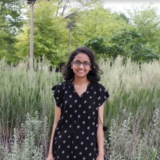 student smiling on campus