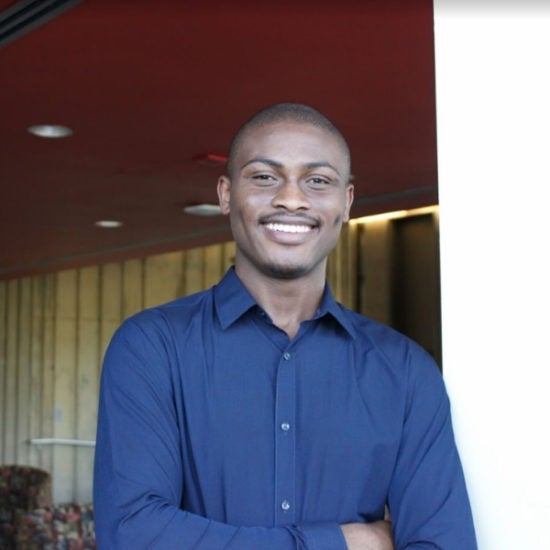 student smiling on campus