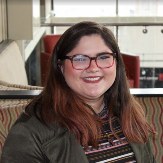 student smiling on campus