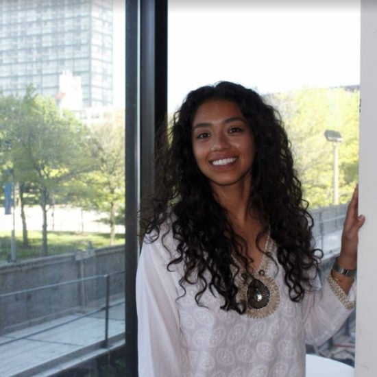 student smiling on campus