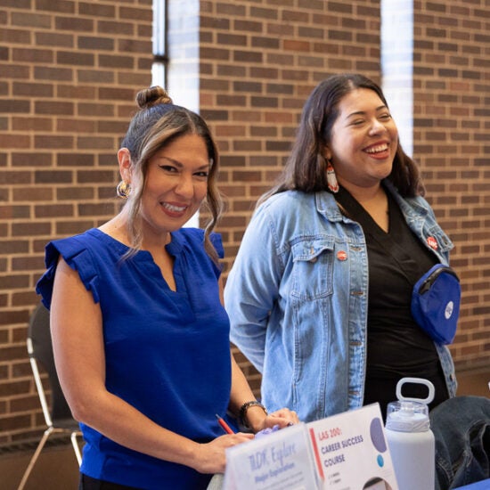 Liz Herrera laughs at career event with student