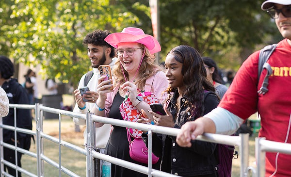 Students at petting zoo during rodeo night at UIC